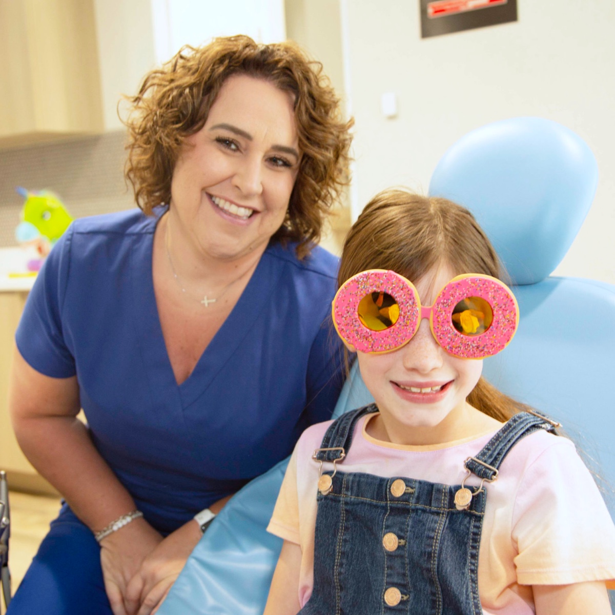 adult patient and team member smiling during visit