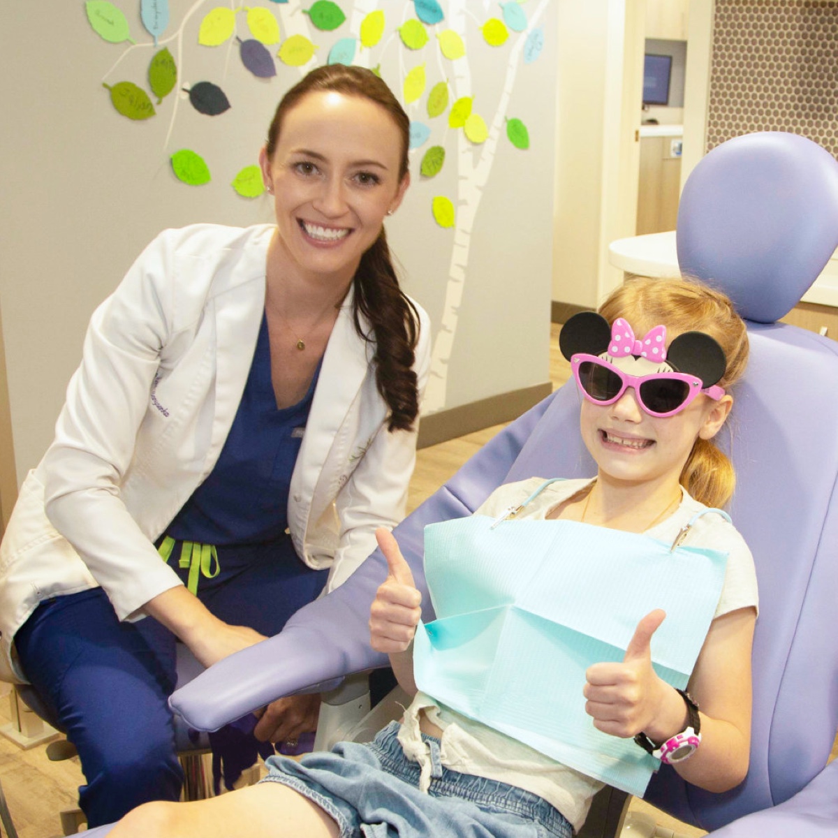 child patient smiling with doctor during visit